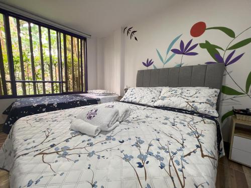 Postel nebo postele na pokoji v ubytování NUEVO Hotel Morada en el centro del Eje Cafetero