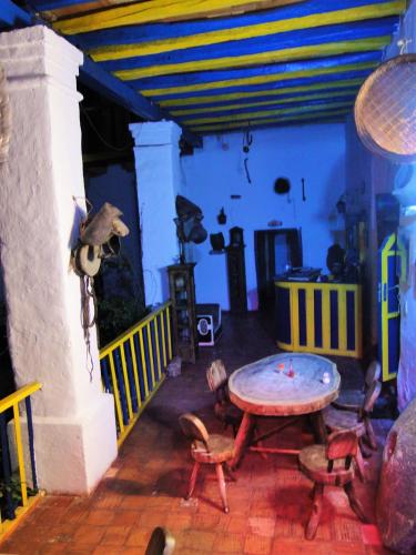 a room with a table and chairs in a room at Hotel Museo la Posada del Molino in El Cocuy