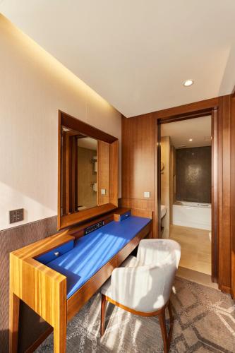Ένα ή περισσότερα κρεβάτια σε δωμάτιο στο Hotel Uri&