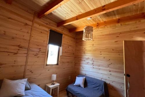 Un lugar para sentarse en Casa R, Cabaña Pichilemu