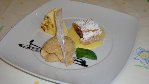 a plate of food on a white plate at Gasthof Edelweiss in Tires