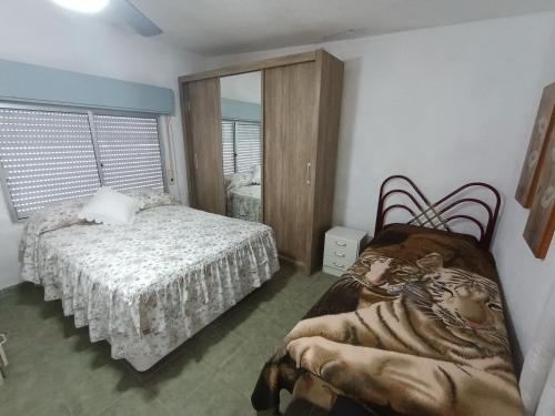 Giường trong phòng chung tại Apartamento céntrico gran terraza