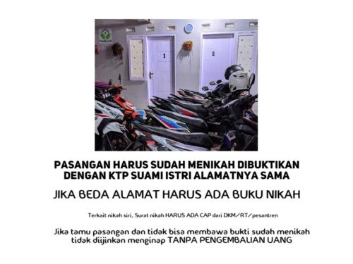 a row of motorcycles parked in a room at Pondok Aulia by Slamet in Padayungan