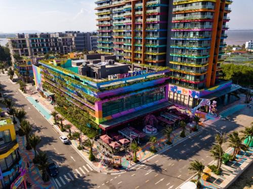 an overhead view of a building in a city at FLAMING0 Ibiza Hải Tiến Resort in Thanh Hóa