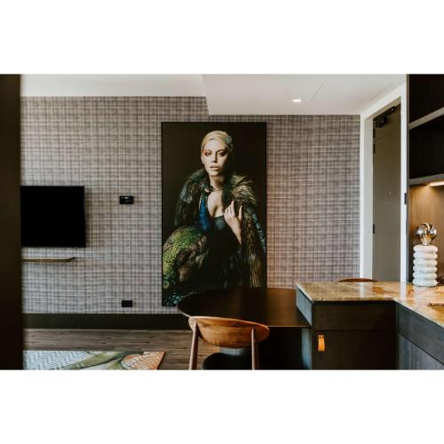a painting of a woman on a wall in a kitchen at The Motley Hotel Richmond, Tapestry Collection by Hilton in Melbourne