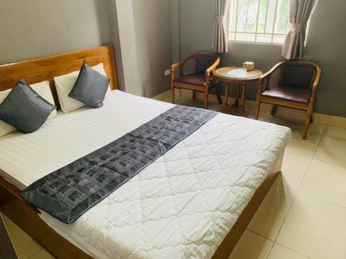 Ένα ή περισσότερα κρεβάτια σε δωμάτιο στο 10h Hotel