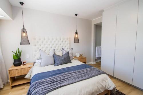 Postel nebo postele na pokoji v ubytování Seabreeze Apartment