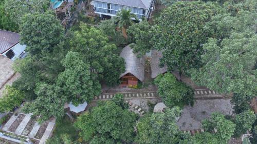 an overhead view of a house surrounded by trees at Ciudad Caliente by The Lavana in Talisay