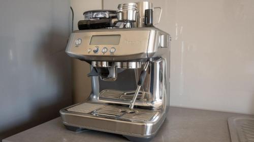 a silver coffee maker sitting on top of a counter at Salt 17 Spacious 3BR Luxury Penthouse in Sorrento