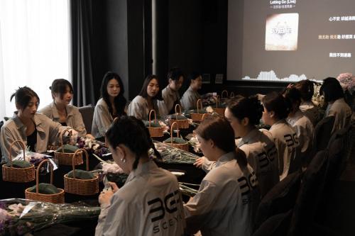 a group of people sitting at a table with baskets at Yakamoz Qianchuan Hotel in Lin'an