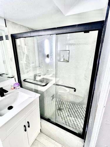 a bathroom with a shower and a white sink at Private Room Near Airport D7 in Brampton