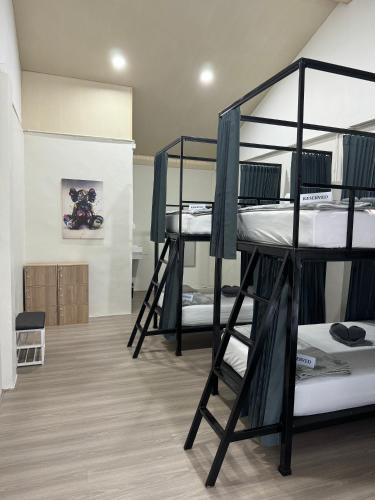 a room with four bunk beds in it at Lingling Hostel in Haad Rin