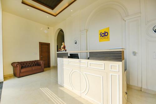 a lobby with a job counter in a building at FabHotel K9 Royal in Ludhiana
