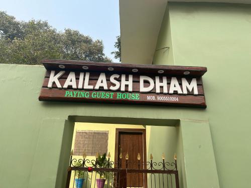 a sign on the side of a building at Kailash Dham in Varanasi