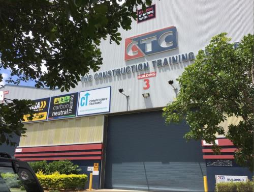 a store with a sign on the top of it at Smart Suites Self Check-in Apartments - Freney Park in Brisbane