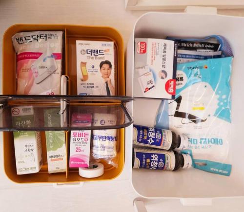 a refrigerator with medicines and other items in it at The best trip of my life at Suwon Haenggung, 4 people, Changnyongmun, relaxation, love stay, essence of Airbnb, beam TV, healing and love stay in Suwon