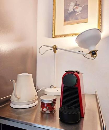 a kitchen counter with a red blender and a lamp at The best trip of my life at Suwon Haenggung, 4 people, Changnyongmun, relaxation, love stay, essence of Airbnb, beam TV, healing and love stay in Suwon