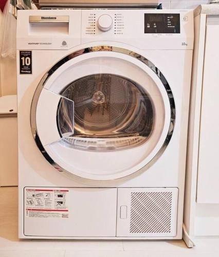 a white washing machine sitting in a kitchen at The best trip of my life at Suwon Haenggung, 4 people, Changnyongmun, relaxation, love stay, essence of Airbnb, beam TV, healing and love stay in Suwon