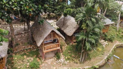 a model of a house with a thatch roof at Ciudad Caliente by The Lavana in Talisay