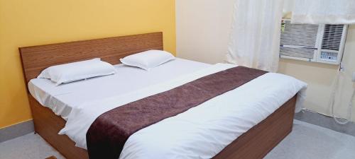 Katil atau katil-katil dalam bilik di Sai Sudha Homestay
