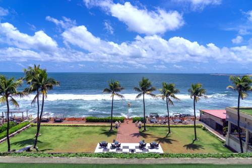 a view of the ocean from the balcony of a resort at Galle Face Hotel in Colombo