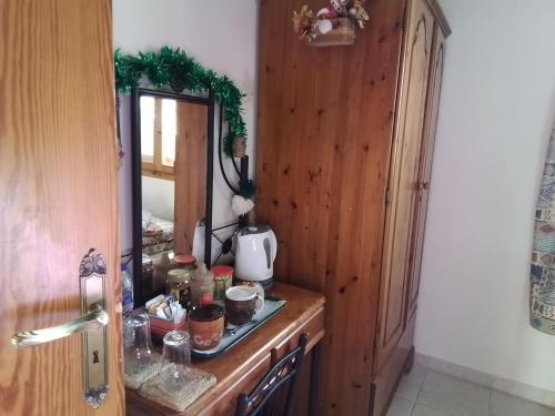 a counter with a mirror in a room at Despina country retreat in Paphos City