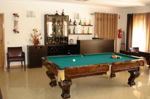 a living room with a pool table in it at Hotel Rural Solar Das Freiras in Figueiró dos Vinhos