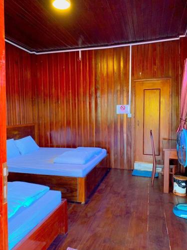 Ένα ή περισσότερα κρεβάτια σε δωμάτιο στο Garden View Lodge & Jungle Tour