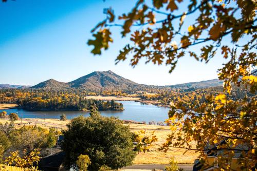 a view of a lake with mountains in the background at Award-winning A-frame Chalet W Cedar Tub & Views in Julian
