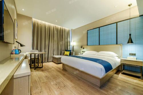 Postel nebo postele na pokoji v ubytování Echarm Hotel Guiyang Xiaohe Huanghe Road Branch
