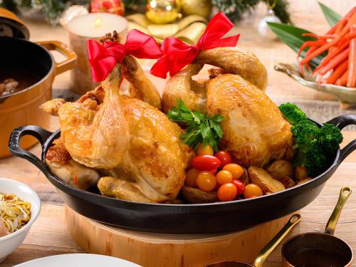 a pan filled with chicken and vegetables on a table at Shin Furano Prince Hotel in Furano