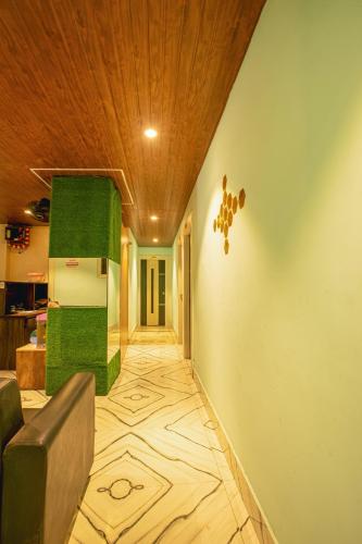 a hallway of a house with a wooden ceiling at Silver Star Residency in Bhubaneshwar