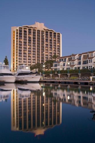 a large building with boats docked in the water at Hyatt Regency Mission Bay Spa and Marina in San Diego