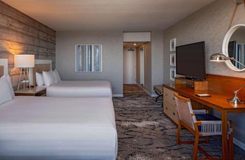 a hotel room with two beds and a desk and a television at Hyatt Regency Mission Bay Spa and Marina in San Diego