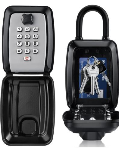 a black cell phone with a key holder at Apartamento com pátio em frente praia in Paço de Arcos