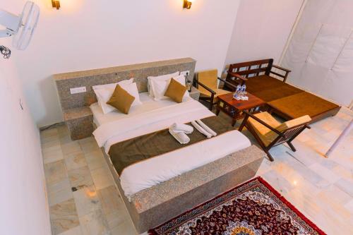 an overhead view of a bedroom with a bed and a table at Marubhumi Luxury Resort in Sām