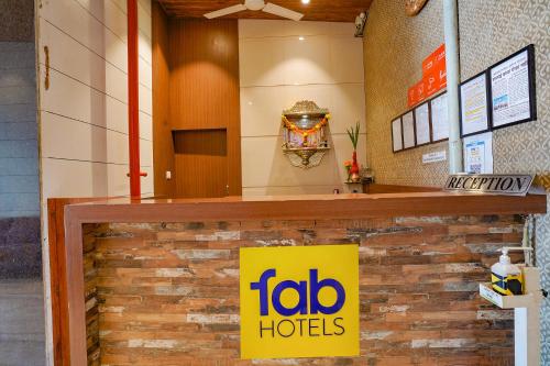 a toro hotels sign on a counter in a building at FabHotel Starwood Residency - Behind BMW Car Showroom in Navi Mumbai