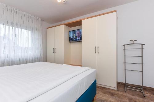 Postel nebo postele na pokoji v ubytování Haus zum Seehund FeWo Seehund 2