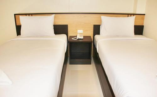 Llit o llits en una habitació de Baansiri Chiangrai