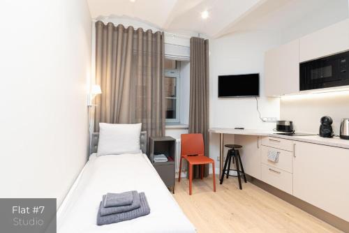 En eller flere senge i et værelse på Dandelion Apartments Elegance