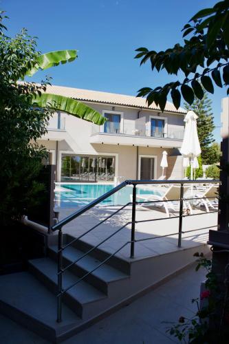 a view of a house with a swimming pool at Notos Luxury Studios in Katelios