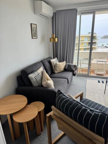 Χώρος καθιστικού στο The Little Beachside Apartment