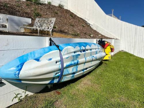 a blue and white boat on the side of a building at Dreamy Lake Retreat & Sunsets in Lake Heights