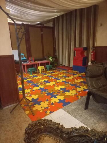 a room with a floor covered in legos at Hotel Duga in Novi Sad