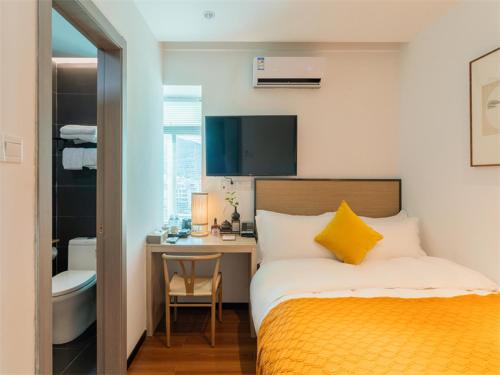 Katil atau katil-katil dalam bilik di Xiamen Wujing Mountain and Sea View Hotel