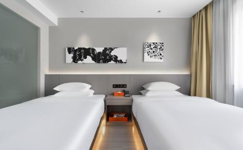 Cama o camas de una habitación en Four Seasons Yijing Hotel