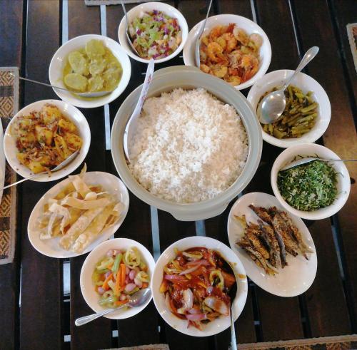 a group of bowls of food on a table at Werala Beach Resort in Kalpitiya