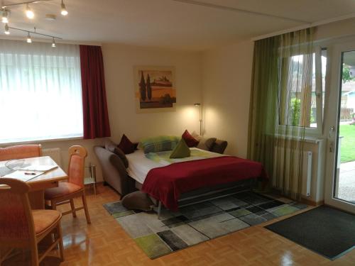 A bed or beds in a room at Ferienwohnungen Oranhof