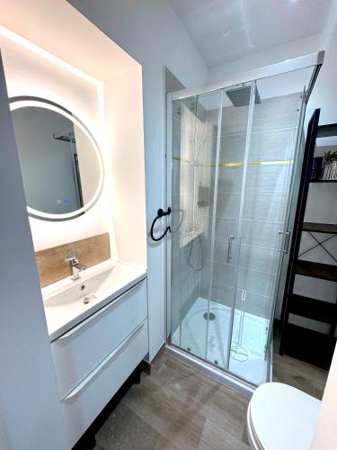 a bathroom with a shower and a sink at Résidence La Ruelle Secrete - 5 studios - in Ruelle-sur-Touvre