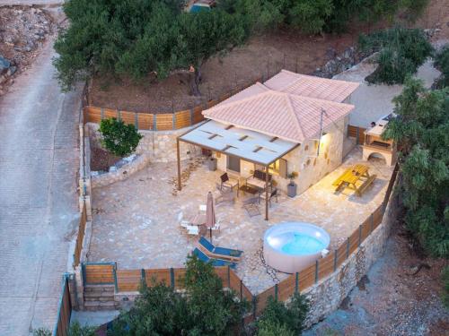 an aerial view of a house with a swimming pool at Tzortzatos Tiny Home in Kouroukláta